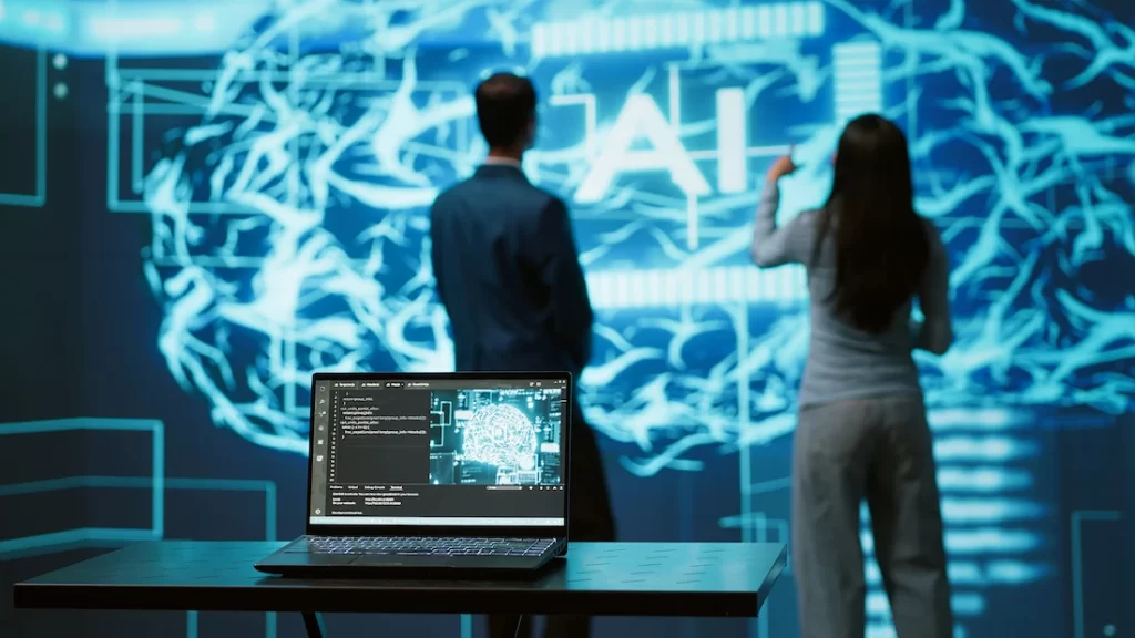 un uomo e una donna lavorano su uno schermo con l'intelligenza artificiale